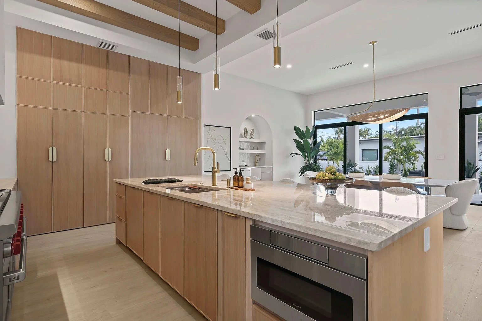 Marble waterfall island detail in a custom Acassa-built kitchen