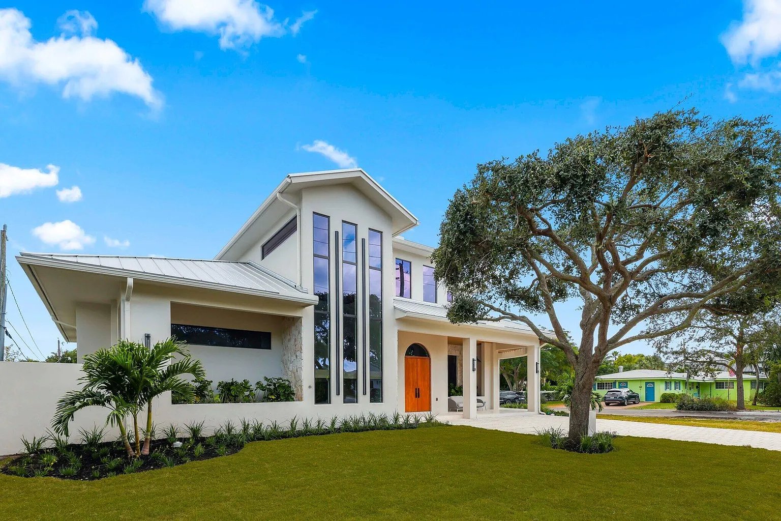Recent Acassa Construction work — custom modern coastal home, three-quarter view